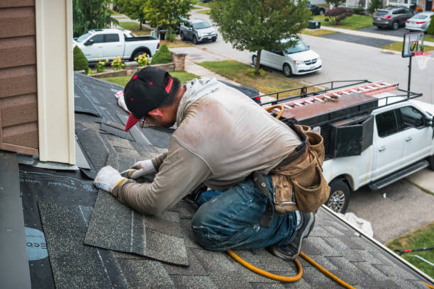 Professional Roofing technician working in Greenvale, NY
